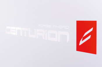 Aufkleber CENTURION FORGE AHEAD, CENTURION
CENTURION-Schriftzug in weiß, mit rotem Logo & FORGE AHEAD-Schriftzug
Größe: 70 x 17,5 cm, Farbe: Weiß/rot/transparent, VE: 1 Stk. - Produktbild - 1