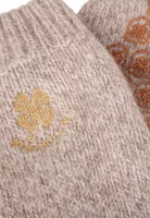Detailbild der Glücklich Stricksocke mit goldener Kleeblatt-Stickerei unterhalb des Bündchens