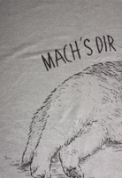 Kuscheldecke Katze Nahaufnahme einer hellgrauen Kuscheldecke mit dunkelgrauem Motive einer ausgestreckten Katze und dem Schriftzug Mach`s dir gemütlich