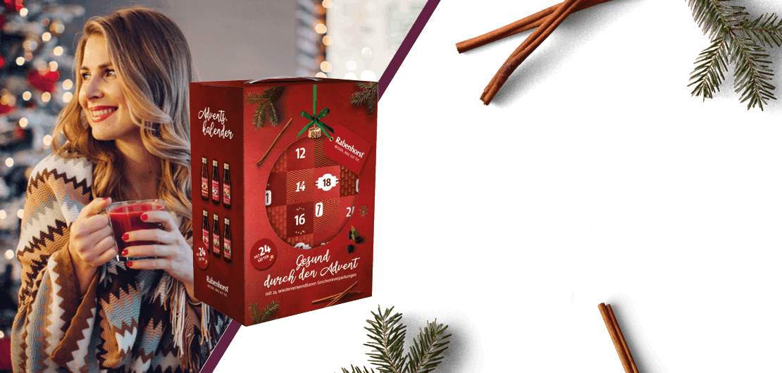 Rabenhorst Slider Adventskalender 2026 mit Frau im Hintergrund in weihnachtlicher Stimmung
