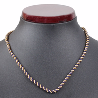 German Wear Bayerische Traditionelle Kordelkette Vorderansicht mit schwarzer Statue German Wear Bayerischer Traditioneller Kordelkette aus gedrehter blau goldener Metallkordel perfekt für traditionelle Anhänger und Trachtenschmuck jetzt kaufen