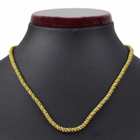 German Wear Traditioneller Kordelkette-Anhänger Vorderansicht mit schwarzer Statue German Wear Traditional Cord Chain Pendant gefertigt aus gold und grün gedrehter Metallkordel ideal für deutsche und bayerische Trachtenschmuck Looks jetzt online bestellen