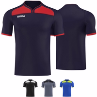 OMKA soccer jersey teamwear Front and rear views of the Omka sports shirt, showcasing its football design with a distinctive red shoulder panel. Made from 100% polyester, this premium quality shirt combines style and durability.