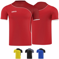 Men's Omka Teamsport Football Jersey Red Front and rear view of the Omka red soccer shirt. This fan jersey blends style with functionality, made from breathable 100% polyester. Its short sleeves make it perfect for soccer enthusiasts seeking both comfort and flair.
