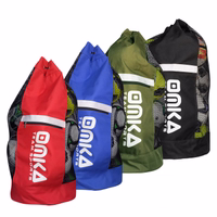 OMKA Soccer Ball Bag Travel Bag Carry Bag OMKA Ball Bags in black, olive, red, and blue shown together. Durable polyester ball sacks with mesh ventilation and shoulder straps, perfect for soccer, rugby, and team sports.