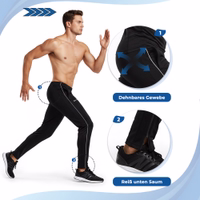 A man running in STRIKER training pants made of stretchy fabric with a zipper at the bottom hem.