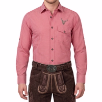 Traditional Long-Sleeved Checkered Shirt with Flap Pockets A man is wearing a red-and-white checkered Bavarian men's traditional shirt with long sleeves a flap pocket and an embroidered stag's head on the left side of the chest paired with traditional brown leather pants against a white background.