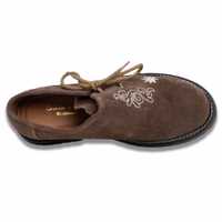 Handmade brown haferl shoes with side lacing and block heels. These German wear shoes feature inner soft leather and are designed to complement lederhosen. The inside of the shoes is labeled with "German Wear."