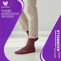 GermanWear label on terry socks, packaging partially visible, German text readable