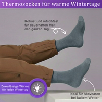 12er-Pack Frottee-Baumwollsocken in Dunkelgrau– ideal für bestimmte Aktivitäten oder kälteres Wetter. Nahaufnahme einer Frottee-Kuschelsocke, Socke flach liegend, Frottee-Struktur sichtbar