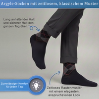 Black business dress socks with argyle pattern, lying flat, German text visible on packaging