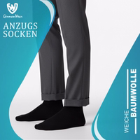 Black business formal sock lying flat, front side visible, German text on packaging visible