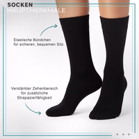 Black business formal sock lying flat, elastic cuff and toe area visible, German text visible