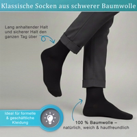 12-Paar schwarze Business-Socken Schwarz Business-Formalsocke flach liegend, Vorderseite sichtbar, deutscher Text auf Verpackung sichtbar