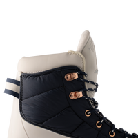BAUER S25 Radiant Heated Skate Senior Puffer Quarter Detail Detail of the Navy puffer quarter and rose-gold eyelets on the BAUER Radiant