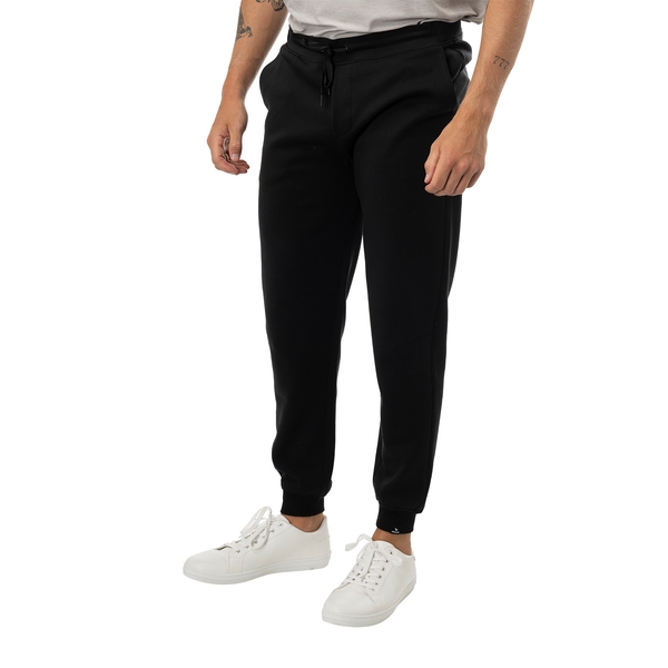 BAUER FLC Core Knit Jogger Senior in black, worn in a side view