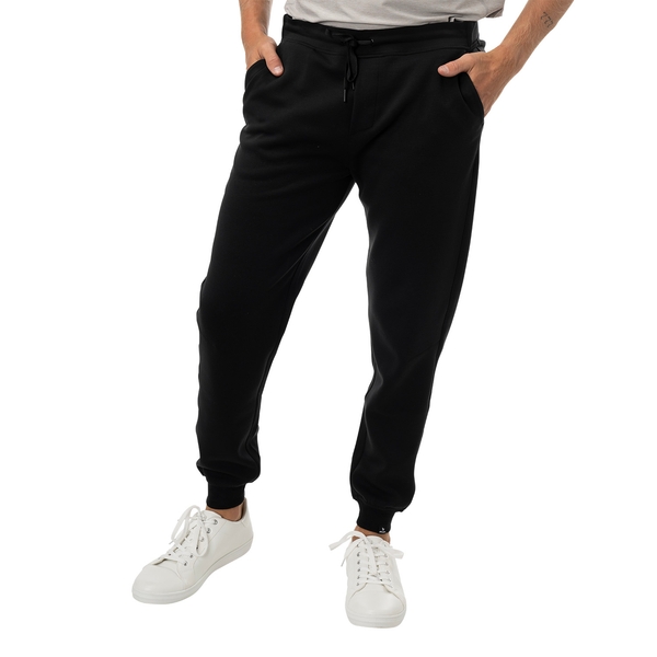 BAUER FLC Core Knit Jogger Senior in black, worn in the front view