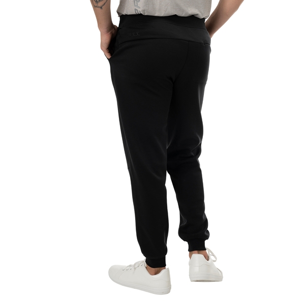 BAUER FLC Core Knit Jogger Senior in black, worn in the rear view