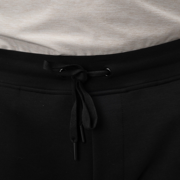 BAUER FLC Core Knit Jogger Senior in black, detail view of the waistband and adjustable drawcord