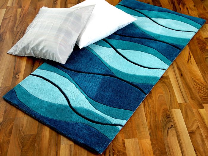 Handtuft Designerteppich Kumino Aqua Blau Wellen